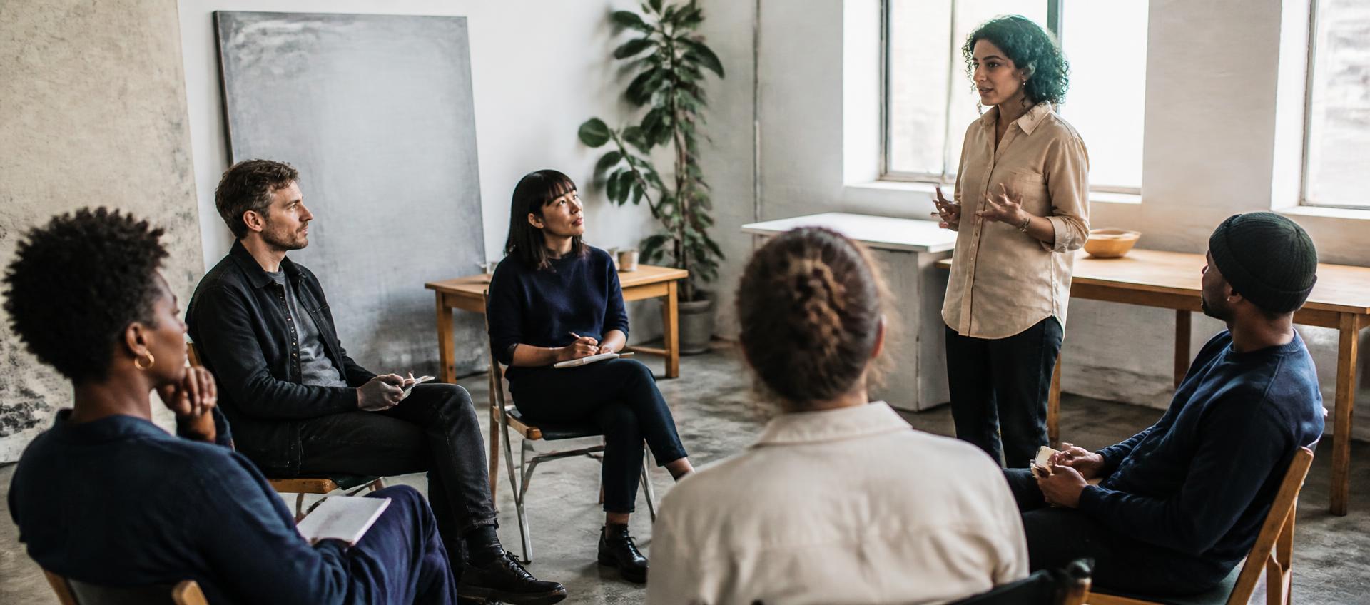Participants mid-practice in a daylight studio room